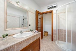 a bathroom with a sink and a shower at Sole Mare di Barbara in Chia +19 photos