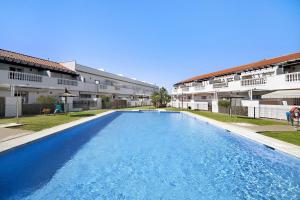 a large swimming pool in front of a building at Casa Costa Ballena Dahlia in Costa Ballena