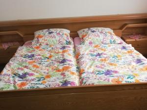 a bed with two pillows on top of it at Ferienwohnung Josefa Ganter 80qm in Ühlingen-Birkendorf