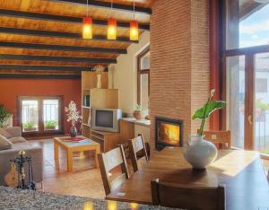 a living room with a table and a fireplace at Apartamento ll in Iráizoz