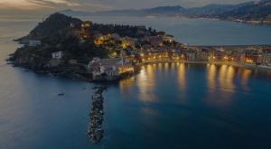 an aerial view of an island in the water at night at Casa vacanze Brezza di Levante in Sestri Levante