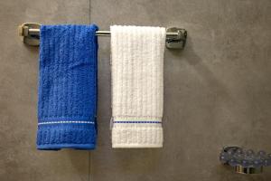 two towels hanging on a towel rack in a bathroom at Villa Alba in Costa Paradiso +44 photos