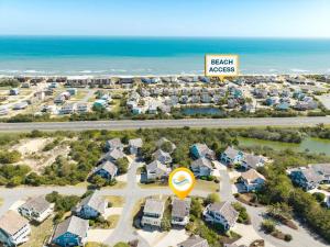 an aerial view of a resort with a sign that reads beach kisses at 6165 - Fantasy Land in Kill Devil Hills +54 photos