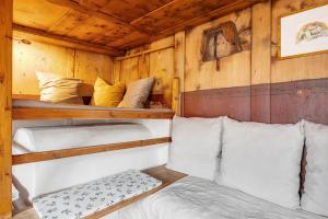 a room with two bunk beds in a cabin at Ferienhaus Leitner in Tires
