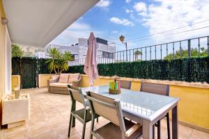 a patio with a table and chairs on a balcony at Amanda in Jávea