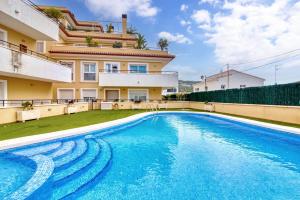 a swimming pool in front of a house at Amanda in Jávea