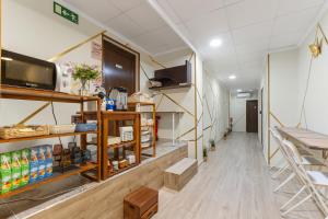 a corridor of a store with a shelf of food at 7A Hostal in Torrevieja