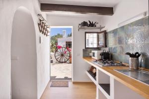 a kitchen with a sink and a counter top at Can Vital 2 in Illes Balears