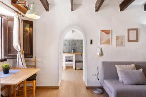 a living room with a table and a couch at Can Vital 2 in Illes Balears