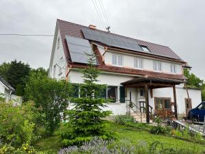 a house with solar panels on the roof at Landhausloft in Bermatingen