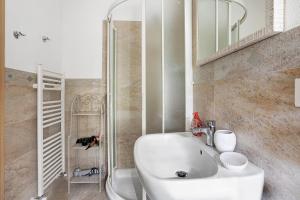 a bathroom with a white sink and a shower at La Rosa Dei Venti in Vernazza +52 photos