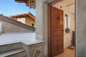 a door to the balcony of a house at Da Manu - Blavy Nus in Blavy