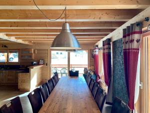 a conference room with a long table and chairs at Chez Gilles chalet haute cimes in Châtel