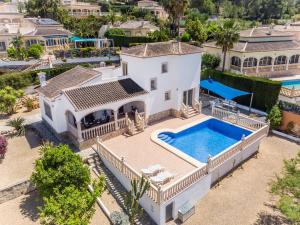an aerial view of a house with a swimming pool at Villa Del Sol - Solo Familias 1819 in Jávea