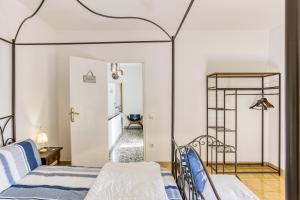 a bedroom with two beds and a hallway at El Figuerar in Palamós +37 photos