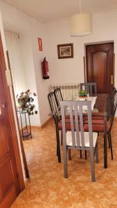 a dining room with a table and chairs at Finca El Carbayal in El Campo +26 photos