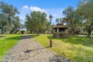 a street light next to a park with trees at Casa Vacanza Da Gabry in Perdaxius