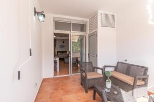 a living room with chairs and a table at Vv Faro in Puerto de Mogán