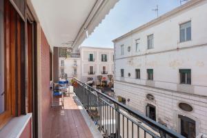 a balcony with a view of a building at Casa Frank 2 in Torre Annunziata