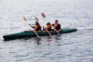 a group of people in a canoe on the water at Apartment Schlossterrassen 4b in Pouch