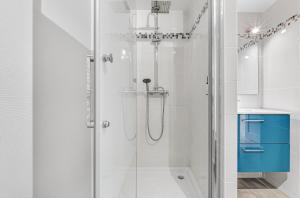 a shower with a glass door in a bathroom at Le Ciel Plein in Embrun +27 photos