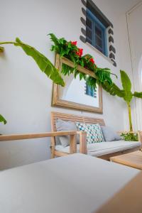 a living room with a christmas wreath on a mirror at Pico Bello Patmos 12 in Patmos +19 photos