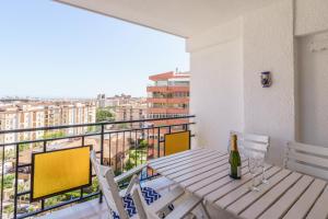 a table and chairs on a balcony with a view at Apartment Acapulco 6 in Fuengirola