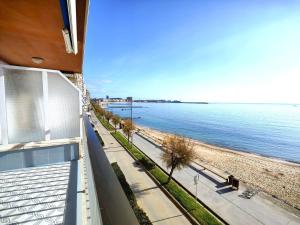 a view of the beach from the balcony of a building at Primera linea Sant Antoni Calonge in Sant Antoni de Calonge