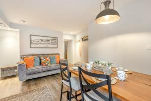 a living room with a table and a couch at 2 Bed in Appledore oc-cosyn in Appledore