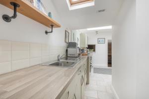 a kitchen with a sink and a counter top at 2 Bed in Appledore oc-cosyn in Appledore +19 photos