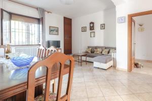 a living room with a table and a couch at Casa Belvedere in Foiano della Chiana