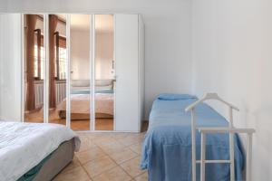 a bedroom with a bed and a mirror at Casa Belvedere in Foiano della Chiana +26 photos