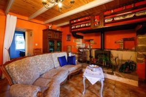 a living room with a couch and a table at Chambre Breizh in Cast