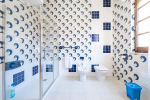 a bathroom with a shower and a toilet at Il Faro in Sarroch +18 photos