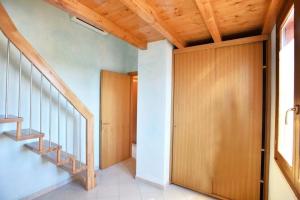 a staircase in a house with wooden ceilings at Luxury Guesthouse Pula in Pula