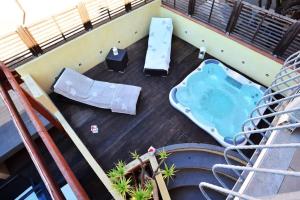 a hot tub on the deck of a building at Luxury Guesthouse Pula in Pula
