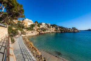 a view of a body of water with buildings at Costa den Blau in Porto Cristo