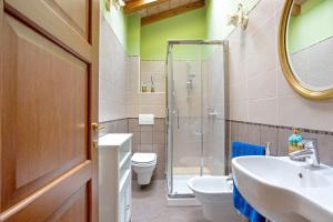 a bathroom with a shower and a sink and a toilet at Villa Gardenia - Private Garden in Sarzana +35 photos