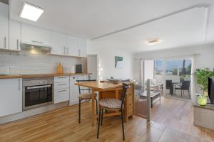 a kitchen with a table and a dining room at Casa Lotti With Ocean View in Santa Cruz de Tenerife