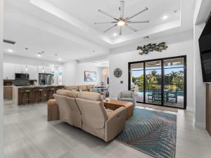 a living room with a couch and a table at Waterfront Haven with Pool Spa Game Room in Port Charlotte