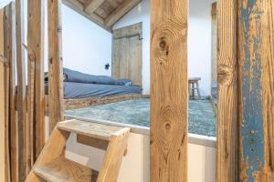 a room with two bunk beds and a bench at Les Petits Loups in Morillon
