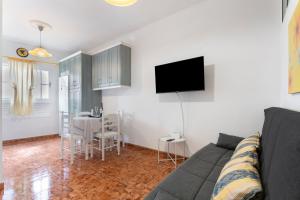 a living room with a couch and a table at Arenas de Sal in La Mareta