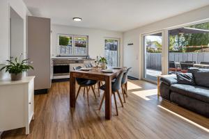 a kitchen and living room with a table and a couch at Stegmann Horn in Gaienhofen +18 photos