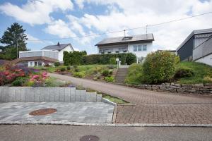 a house on a hill with a walkway at Ferienwohnung Barbara in Karsau
