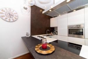 a kitchen with a table with a glass jar on it at La Dimora del Benessere in Noicattaro