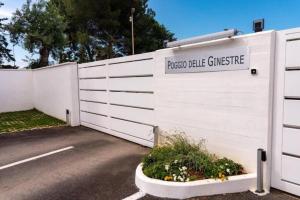 a white fence with a sign that reads special value garage at La Dimora del Benessere in Noicattaro