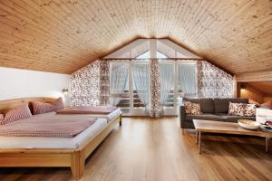 a living room with two beds and a couch at Josenhof in Wolfach