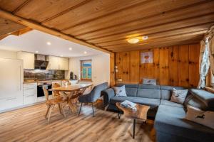 a living room with a couch and a table at Josenhof in Wolfach