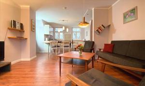 a living room with a couch and a table at Ferienwohnung Schmilau in Schmilau