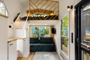 an interior view of a tiny house with a porch at Tiny House Nr 6 in Schwielowsee